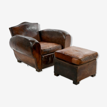 Club armchair and leather ottoman