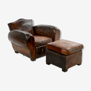 Fauteuil club et son pouf en cuir