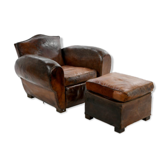 Club armchair and leather ottoman