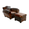 Club armchair and leather ottoman