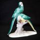 Earthenware figurine, a pair of German porcelain parrots