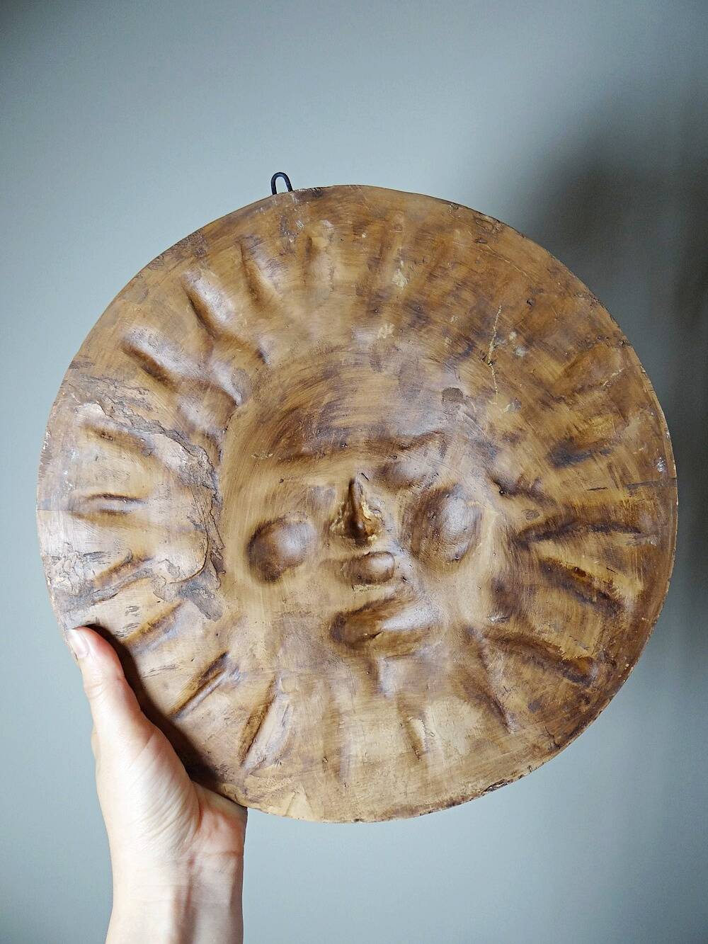 Anthropomorphic sun wall sculpture in patinated terracotta, vintage Italian craftsmanship.