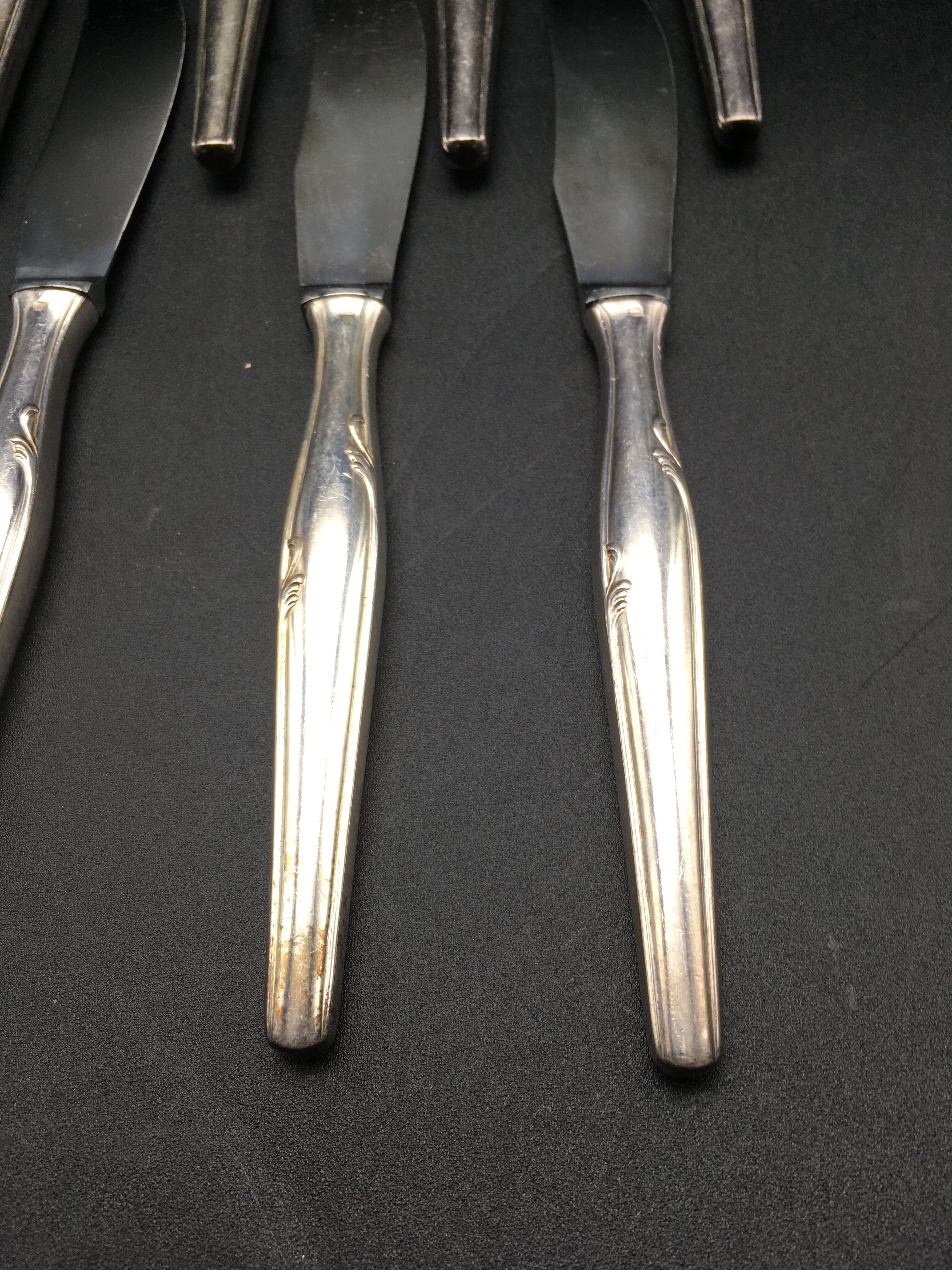 12 silver metal knives