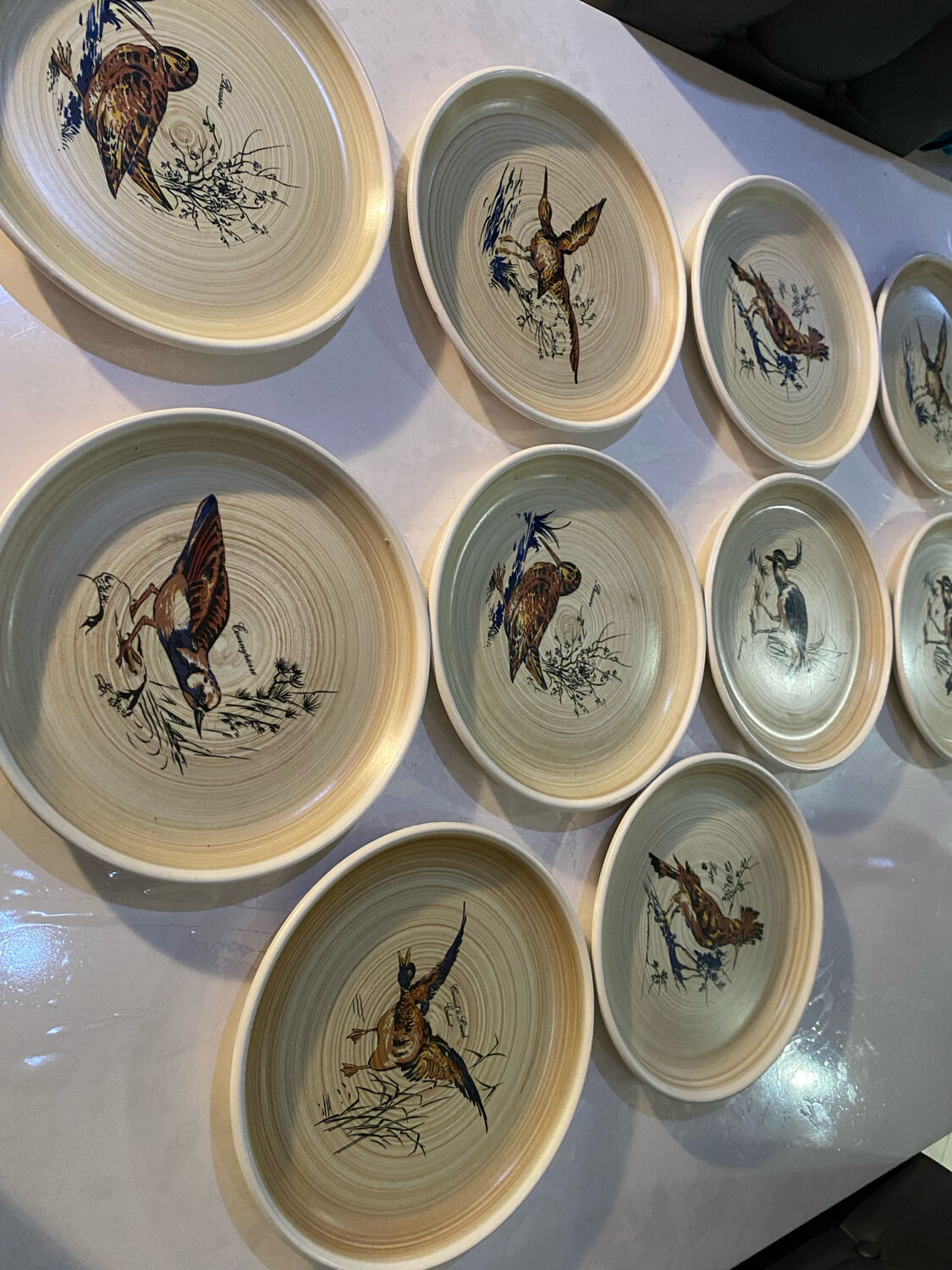 Many vintage flat plates from Sarreguemines.