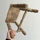 Antique wooden stool with four turned legs.