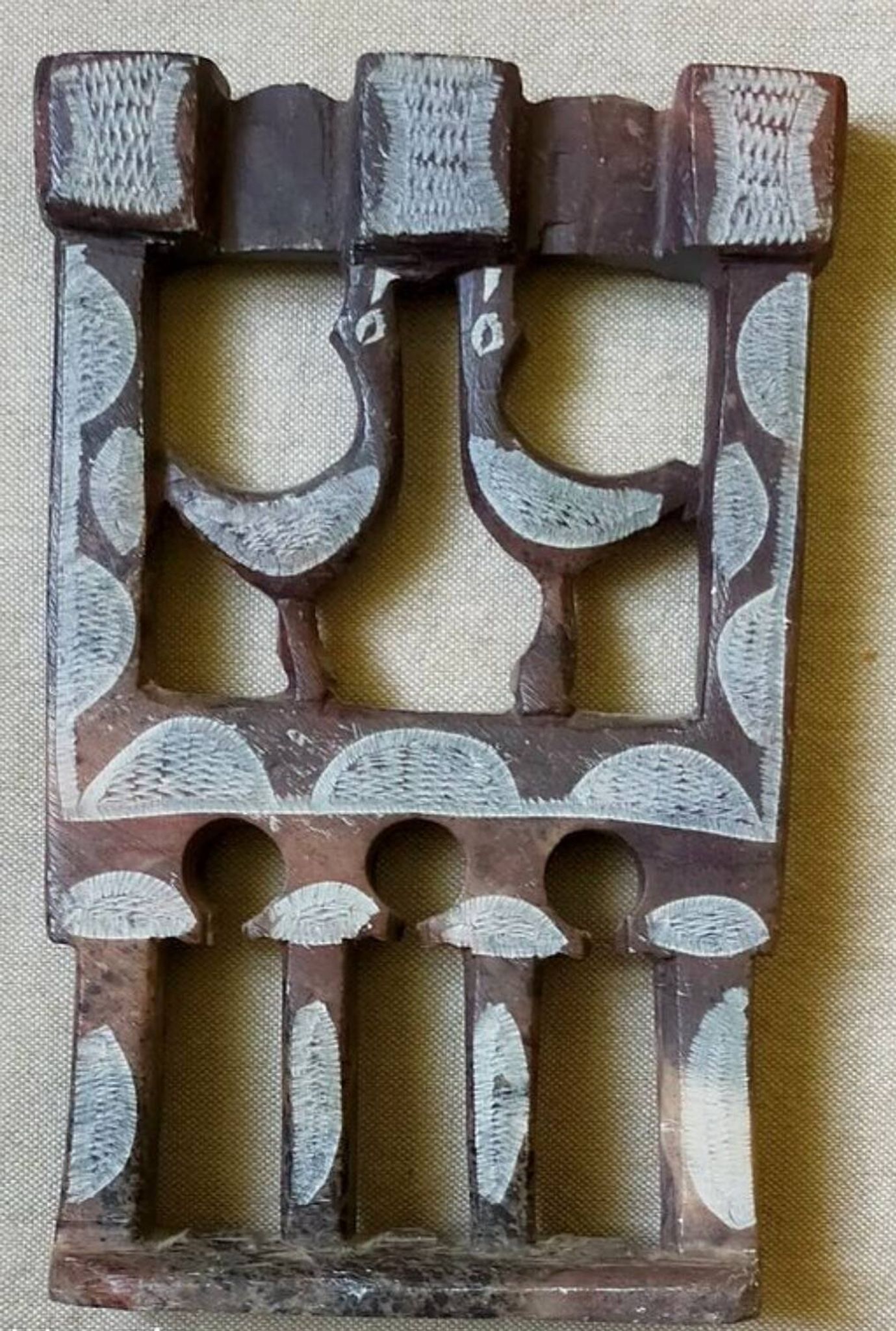 Three-branched stone candlestick adorned with birds, North Africa