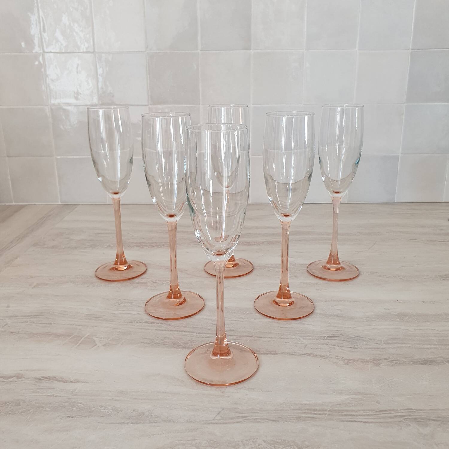 6 champagne flutes with pink stems