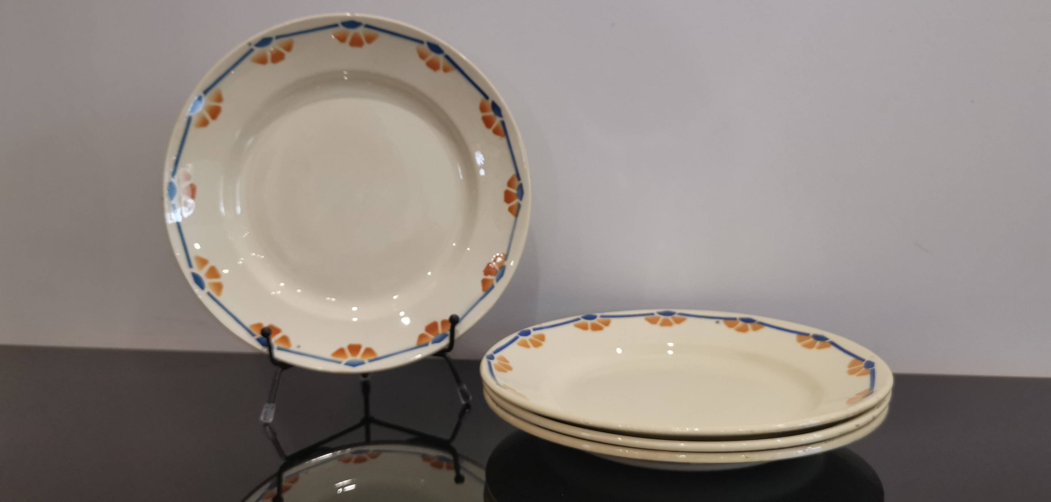 Old semi-deep plates in Terre de fer earthenware