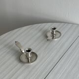 Pair of shiny silver metal candlesticks