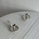Pair of shiny silver metal candlesticks