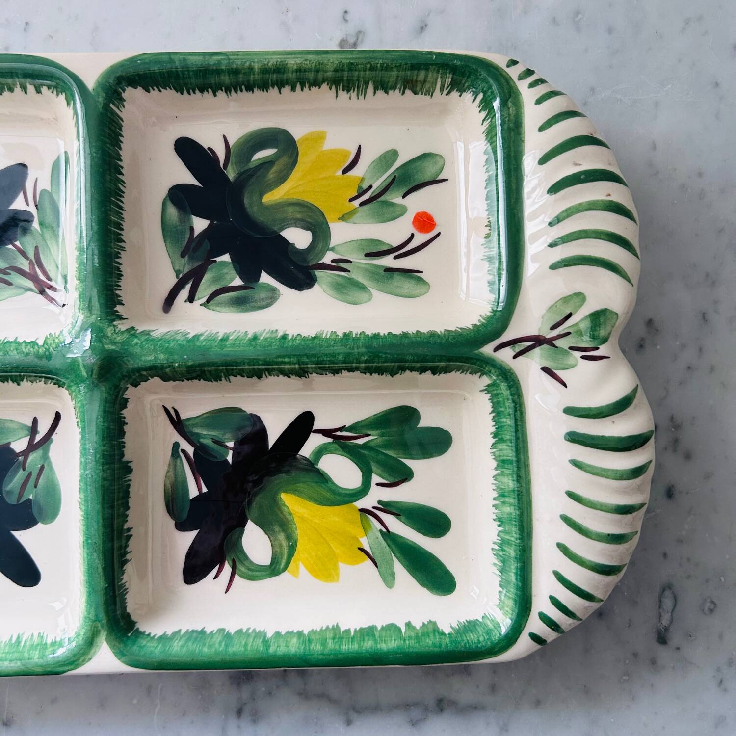 Serving dish with floral decoration signed