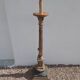 Large antique church candlestick in carved wood transformed into a lamp.