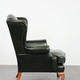 Smooth classic cowhide Chesterfield armchair in a stylish dark green color