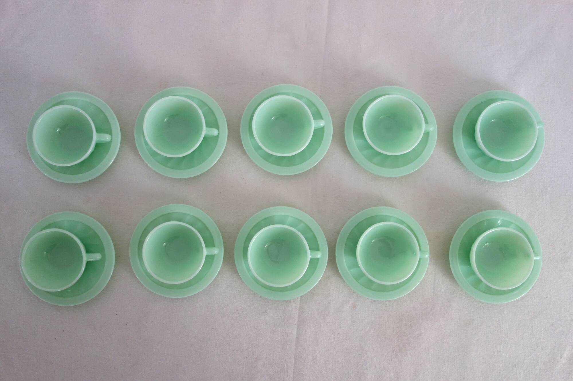 10 almond green opaline cups and saucers from the 50s