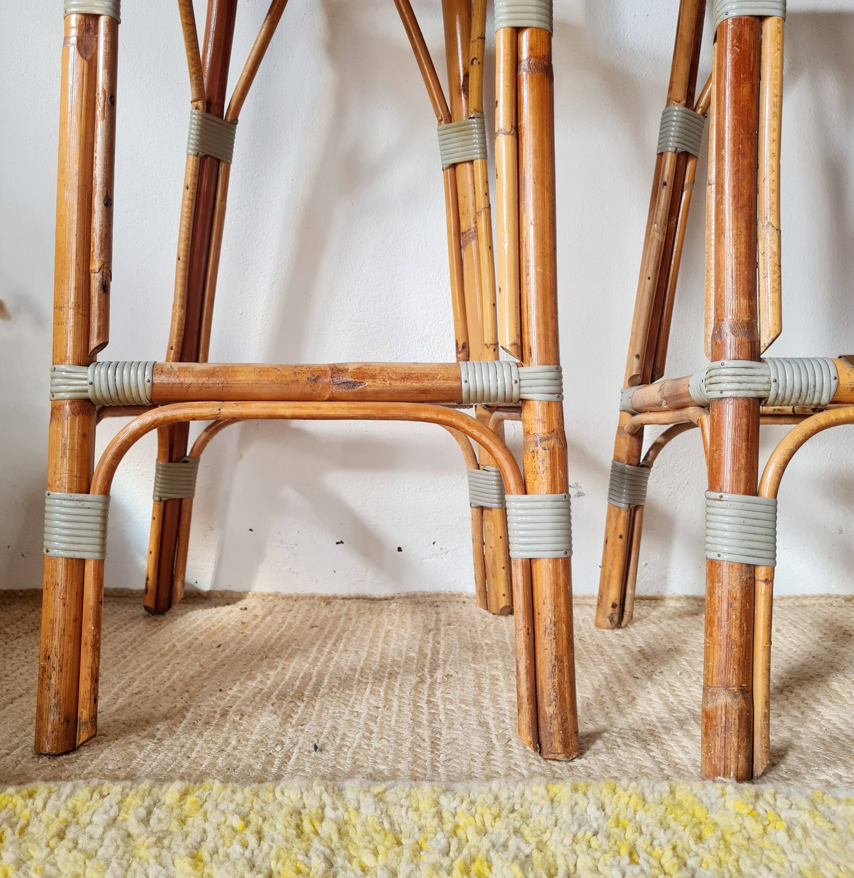 Pair of vintage Gatti bar stools in two-tone rattan and caning.
