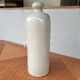 Vintage bottle in enamelled sleet