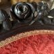 Napoleon III medallion armchair in carved wood and red velvet.