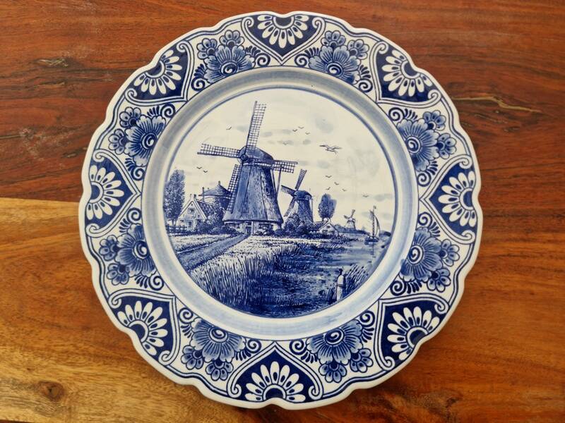 Delft Blue earthenware plate with a mill by a river decoration