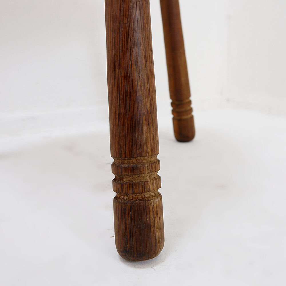 Rustic tripod stool with a triangular seat, 1960s.