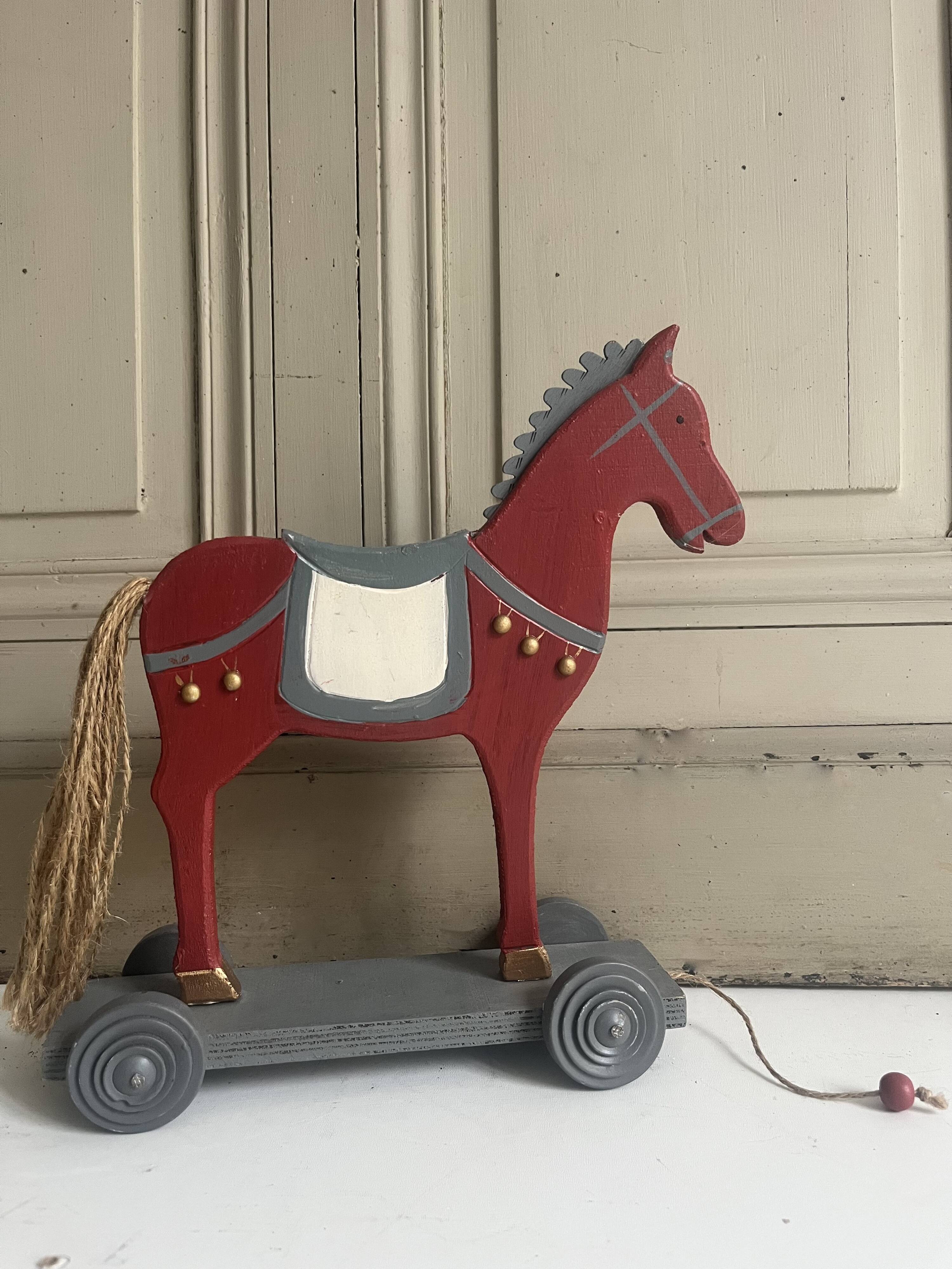 Antique toy, small horse on wheels