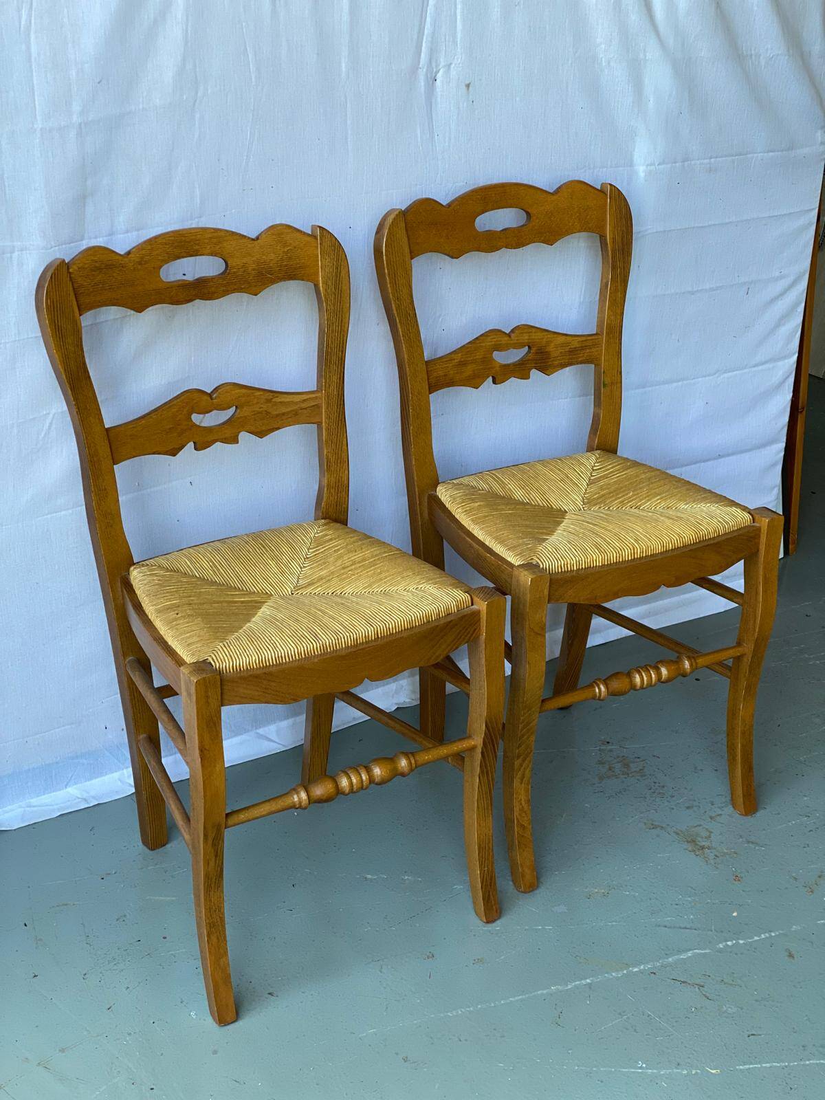 2 solid wood and straw dining chairs
