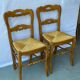 2 solid wood and straw dining chairs
