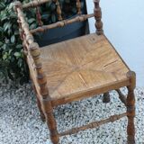 Chaise d’angle ancienne en bois façon bambou assise en paille