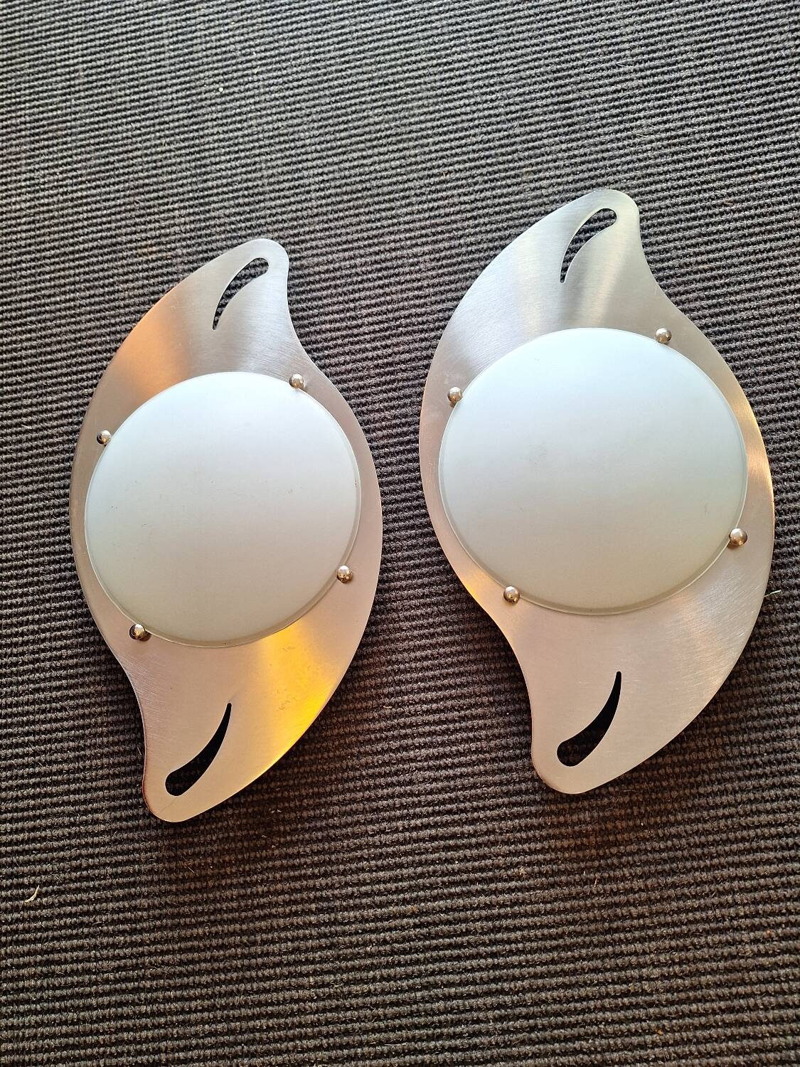 pair of 20th century stainless steel wall lights with opaque glass