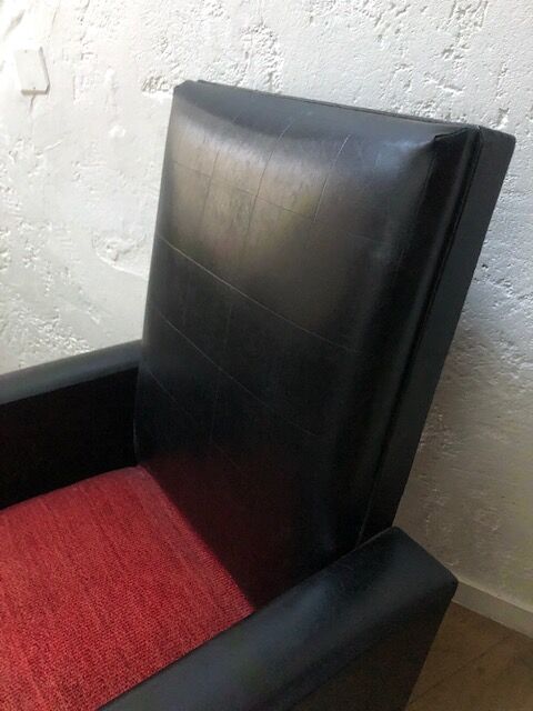 Vintage armchair in red and black skaï