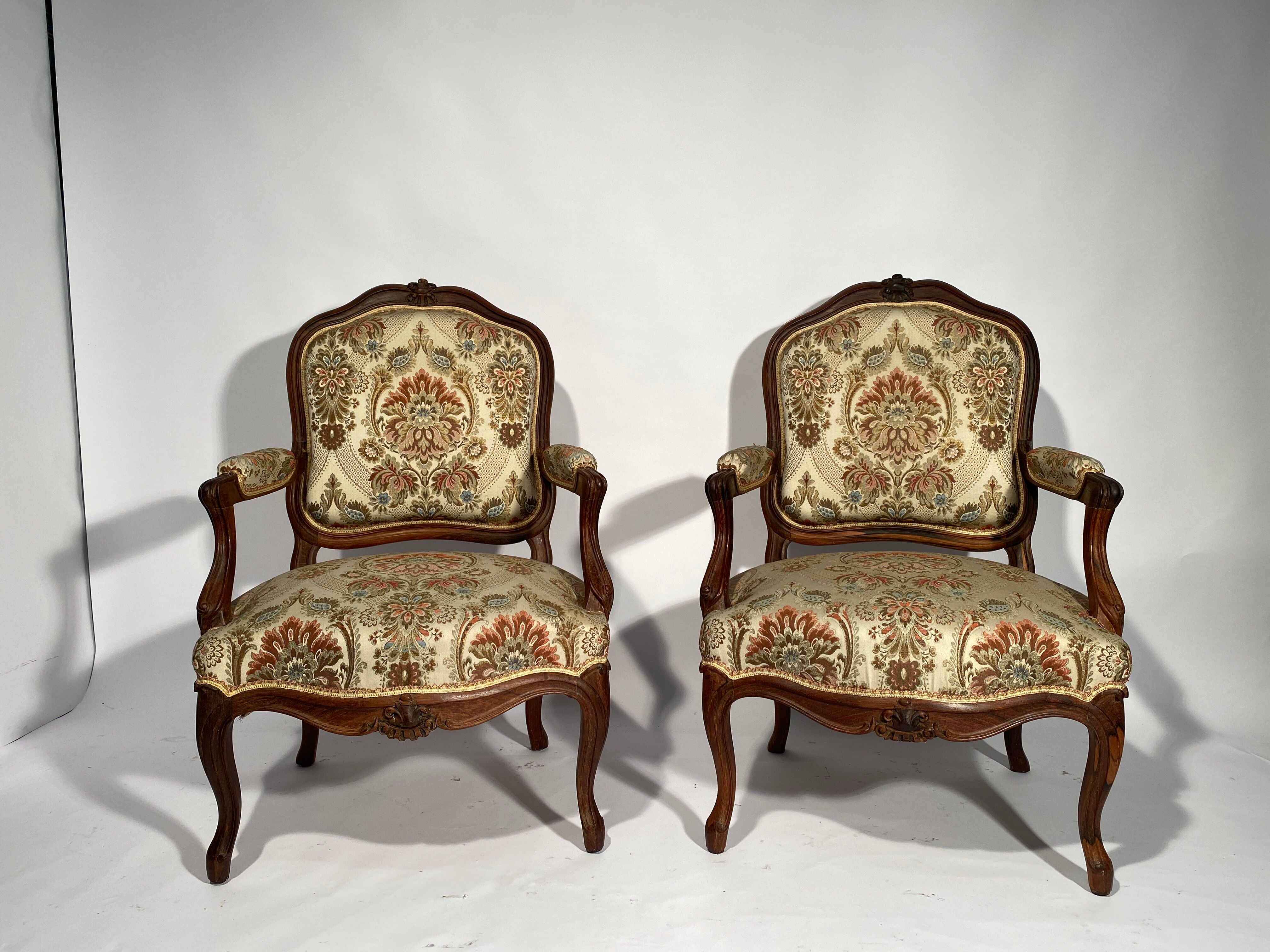 Louis XV style living room including a pair of armchairs and three chairs