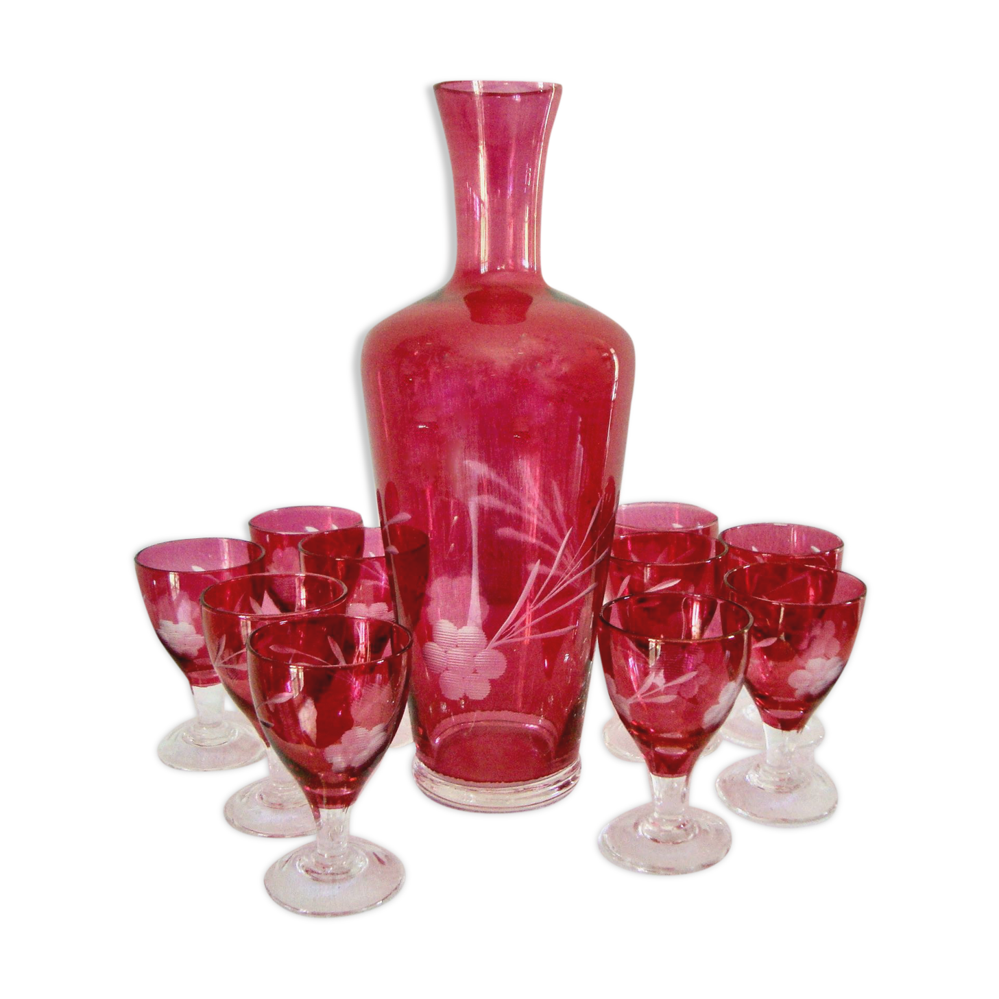 10 glasses and carafe with alcohol or liquor