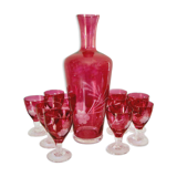 10 glasses and carafe with alcohol or liquor