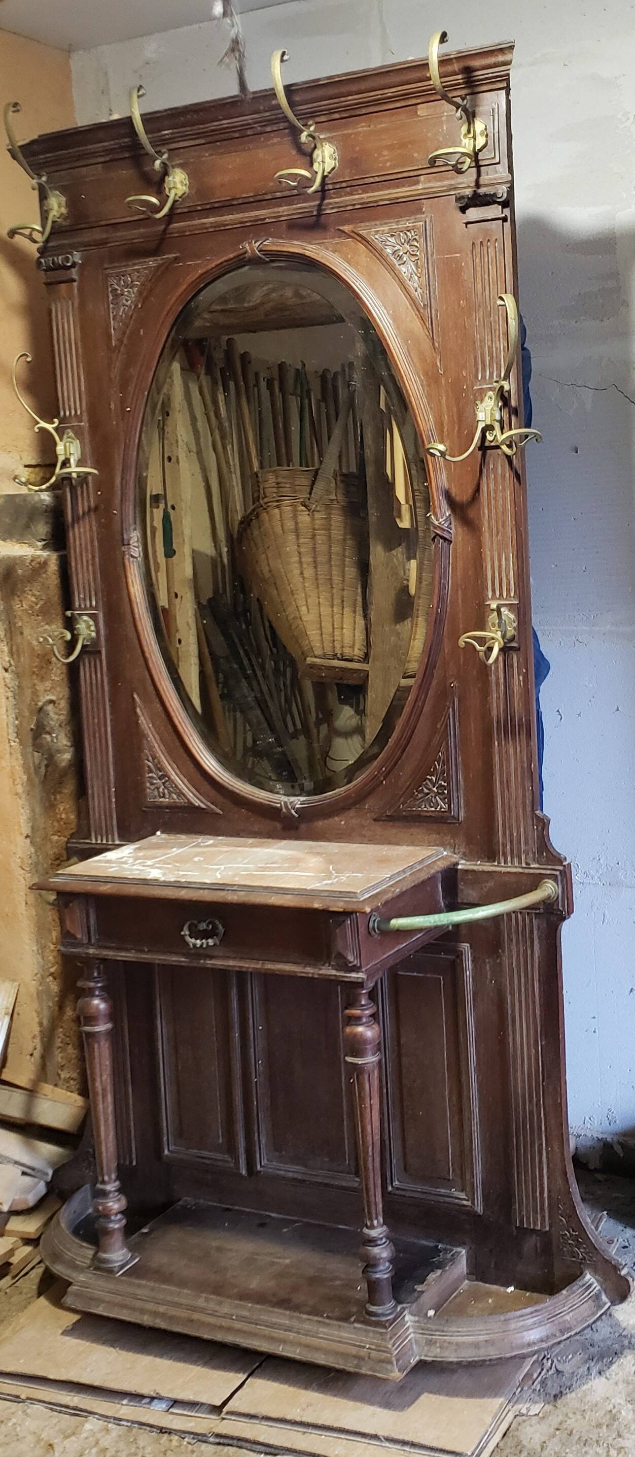 Coat rack with oval mirror