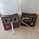 Philips wall sconces in wood and white opal.