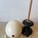 Ostrich egg on blackened wooden base