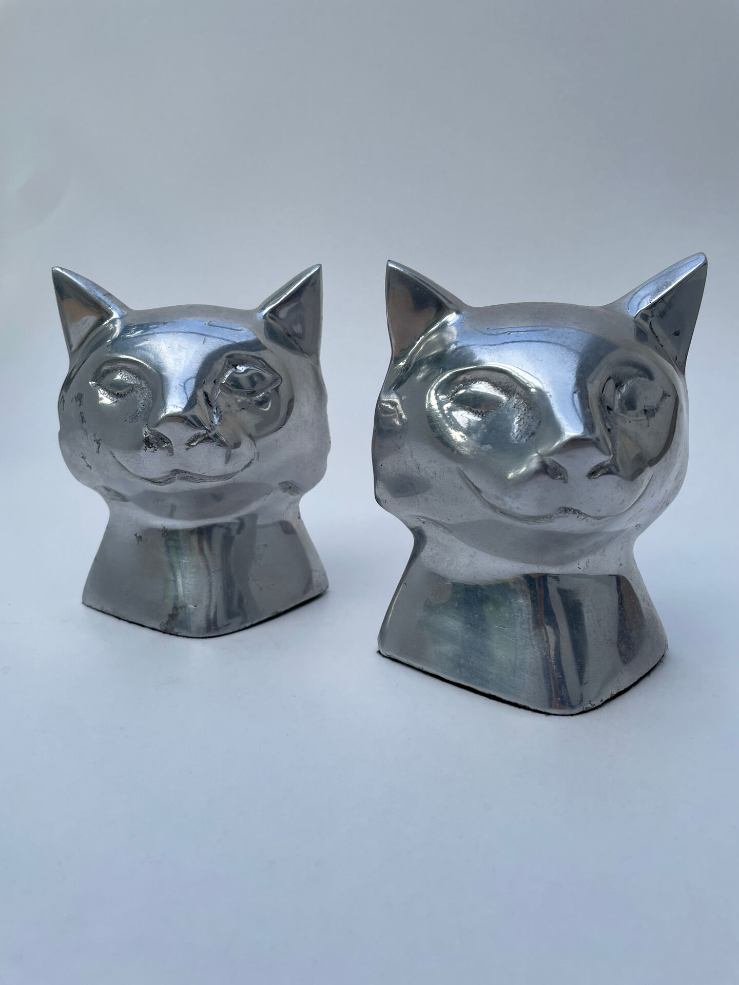 Pair of designer cat head bookends