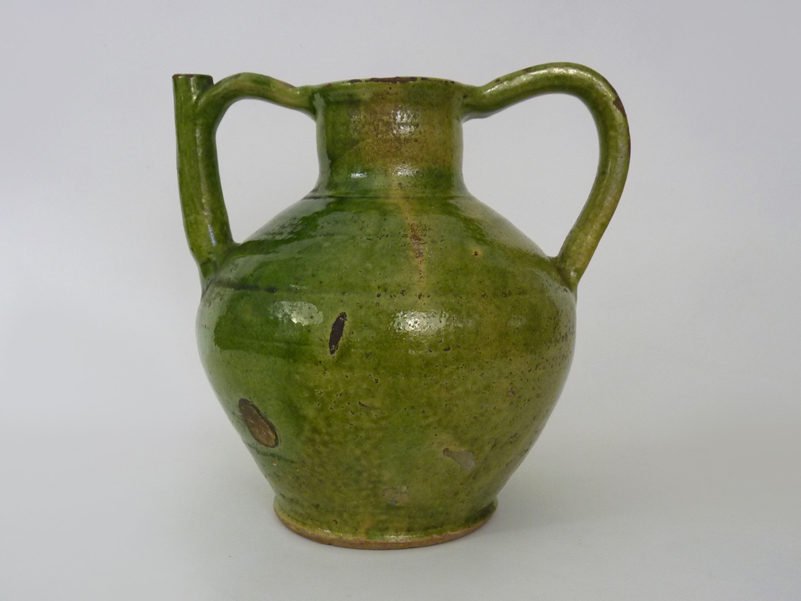 Pitcher pottery in green glazed terracotta, south west of France. XIXth