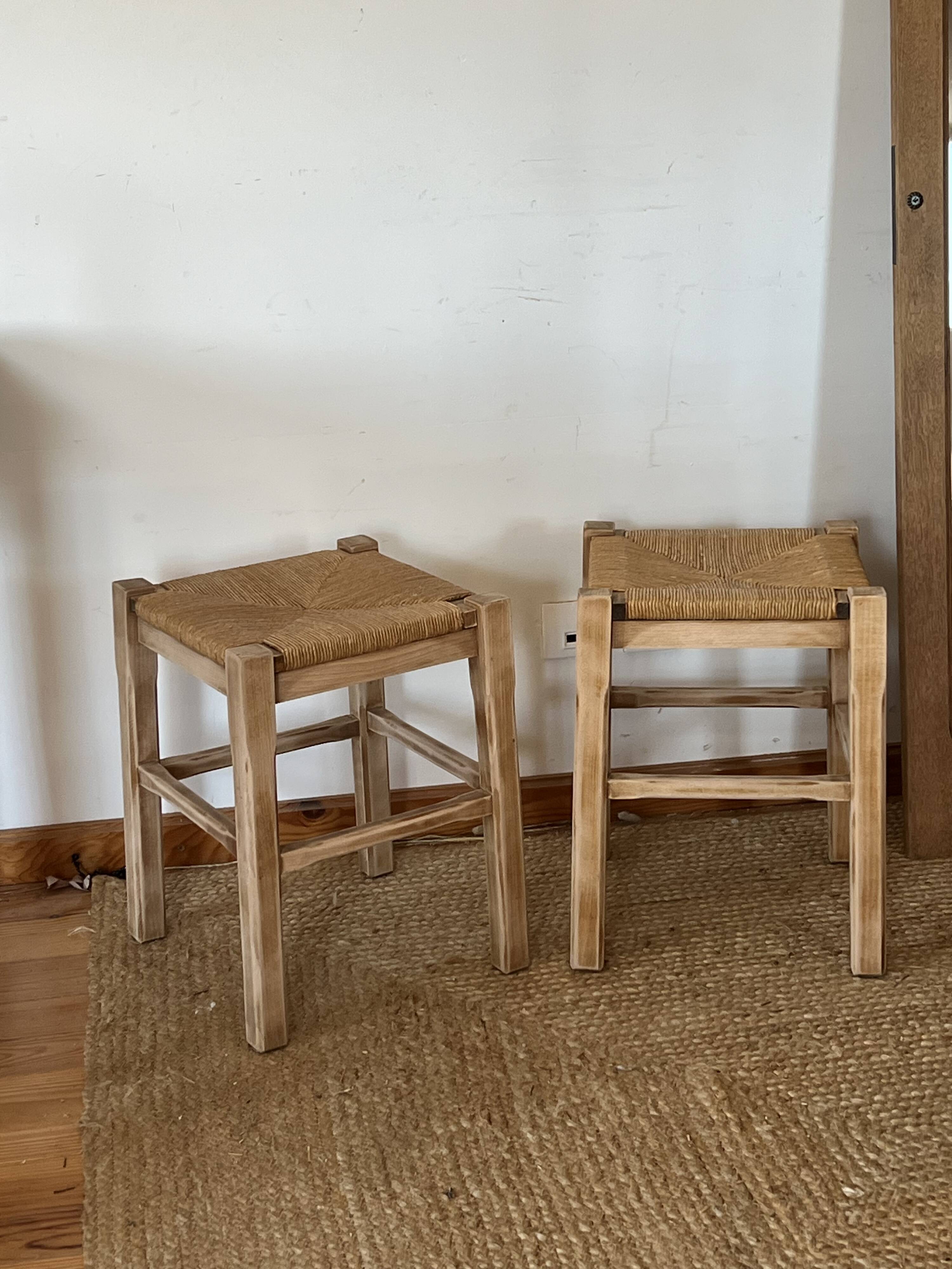 Pair of antique stools in raw solid wood with straw seats.