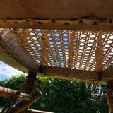 Old baby high chair in wood and canework