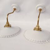 Swan neck sconces in serrated opaline