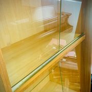 Double display case mounted at an angle with doors from the Capelle 60' house in Montauban