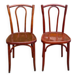 2 curved solid wood bistro chairs in Bordeaux.
