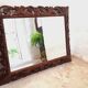 Beveled carved wood mirror 110x84cm