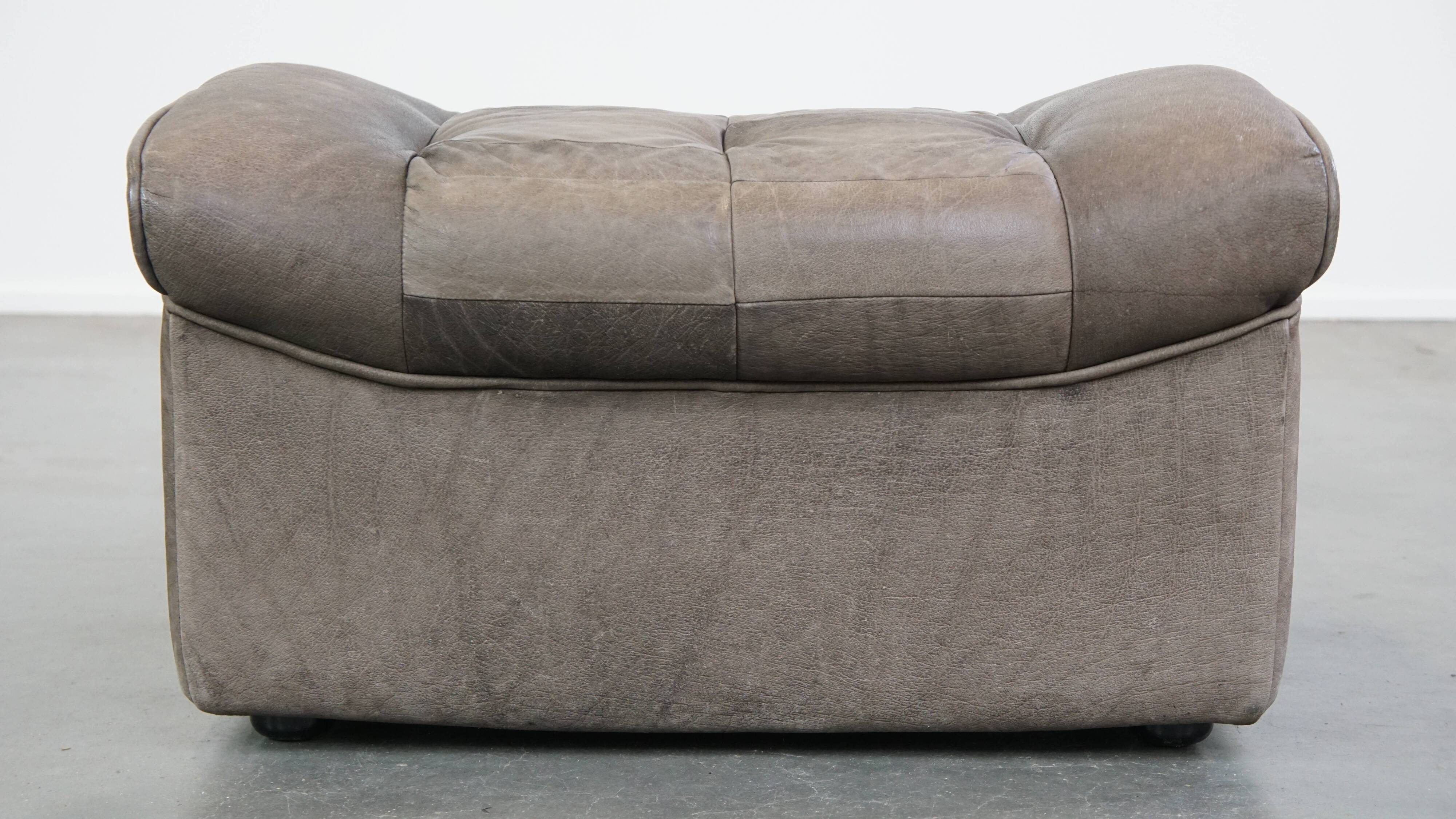 Luxurious, comfortable, gray leather vintage footstool