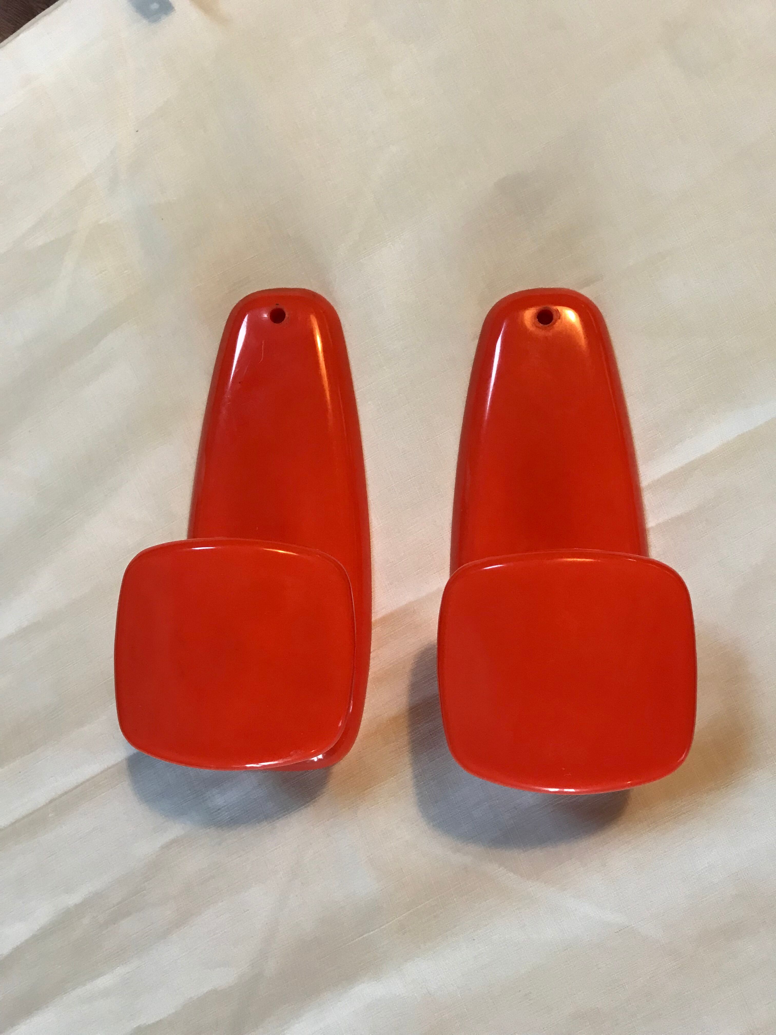 2 orange plastic hooks 70s.
