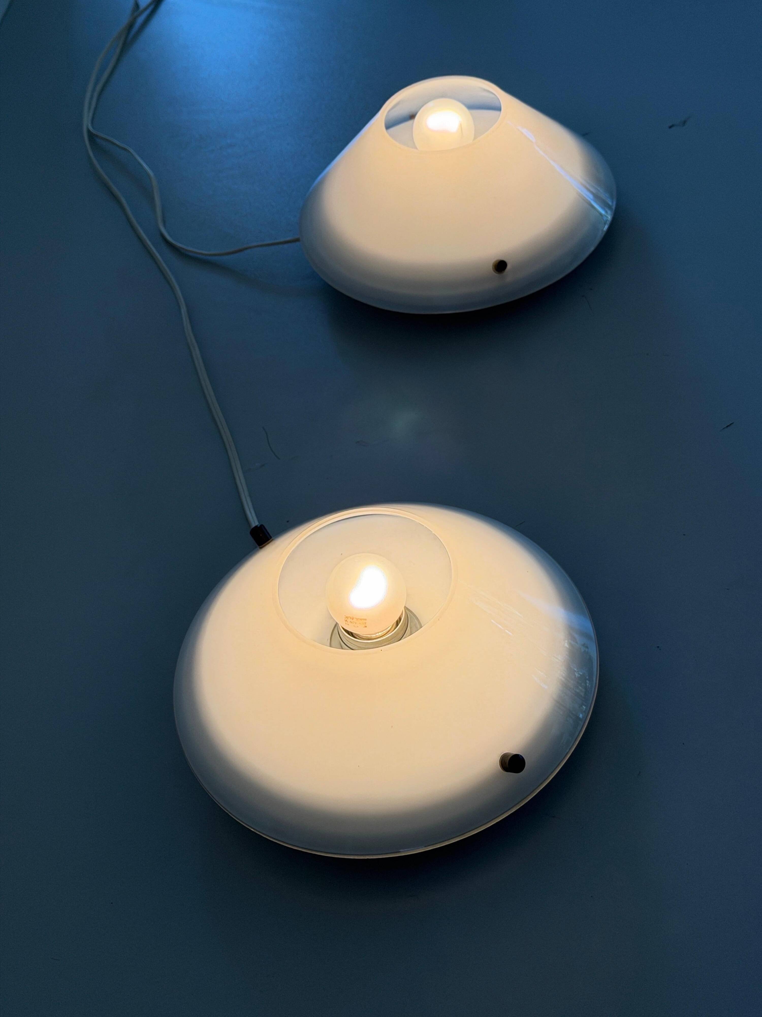 Pair of opal glass wall lights from the mid-century by Lamperti, 1960s, Italy.