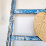 Old ladder in blue wood