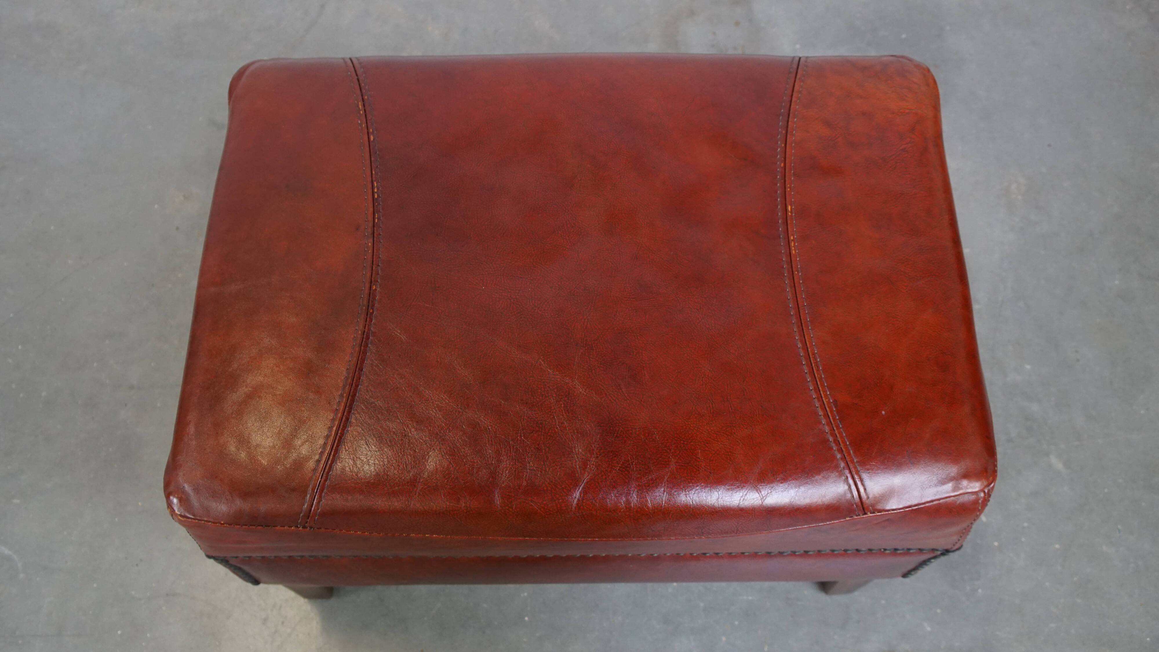 Ottoman couleur cognac en cuir de vachette