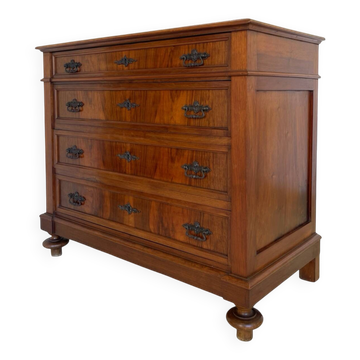 Antique walnut commode with bronze handles in the shape of a lion's mask,