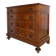 Antique walnut commode with bronze handles in the shape of a lion's mask,